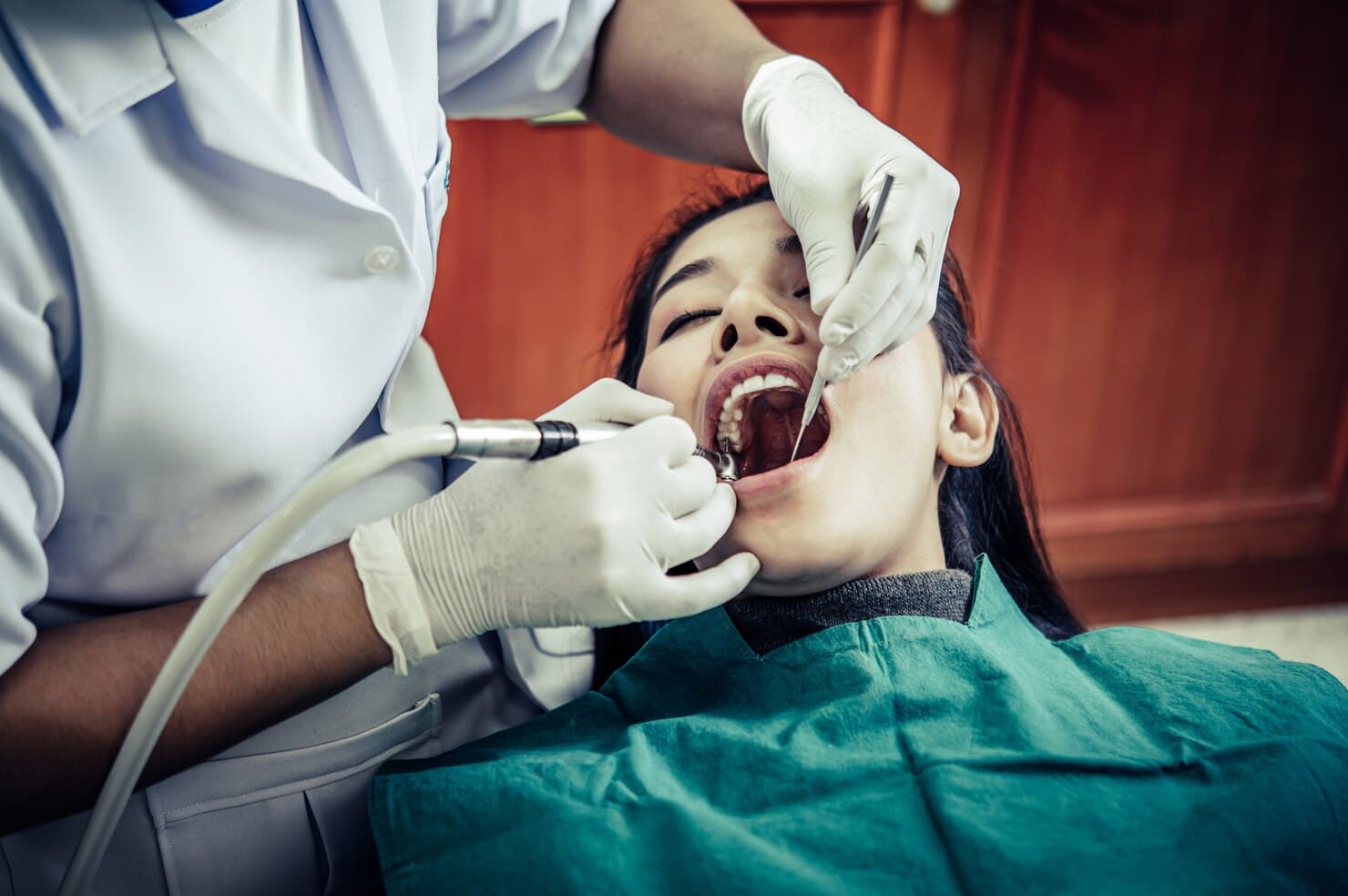 Dental specialist treating a patient at Alpha Dental Studio